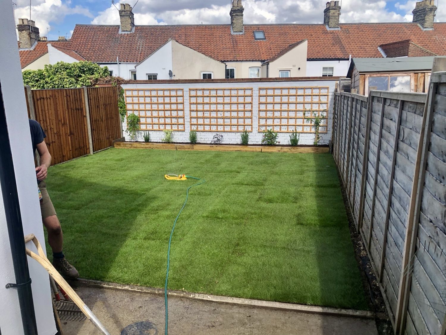 Wider view of the new lawn after the garden makeover